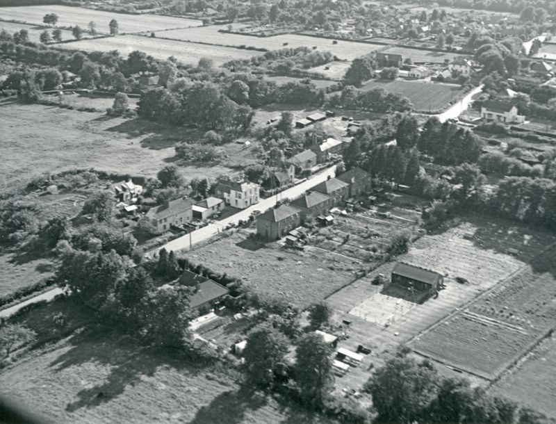  Jack Botham aerial photograph 2220. East Road with the Fox near the centre. The Fox still has the hall on its eastern side. Brierley Hall and barn top right. 
Cat1 Aerial Views-->Mersea