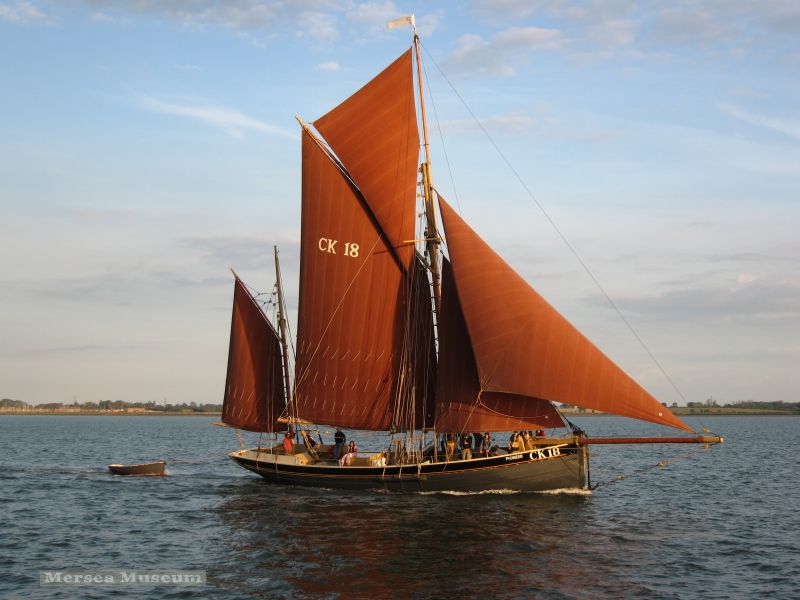  Smack PIONEER CK18 sailing into the evening sun on the River Blackwater. She was built 1886, derelict and sunk 1942, restored and relaunched 2003. 
Cat1 Smacks and Bawleys