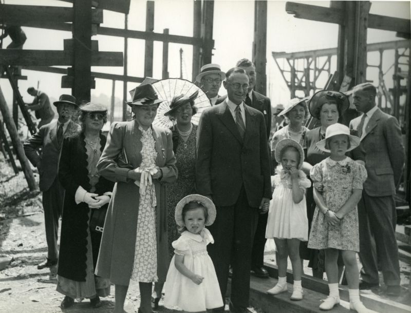  Minesweeper Launching at Wivenhoe Shipyard. 

L-R Leonard Archer ?, unknown lady, Agnes Mary Pullen, Mildred Lait (with parasol - Diane Stoker's Aunt), Penelope Margaret Ann Pullen age 3, William (Bill) Lait - jeweller from London (Diane Stoker's uncle), Basil Ivan Pullen - Landlord of the Peldon Rose, Leo Michael-Smith - Landlord of the White Hart West Mersea, Winifred Michael-Smith - Leo's ...
Cat1 Places-->Wivenhoe-->Shipyards Cat2 People-->Other Cat3 War-->World War 2