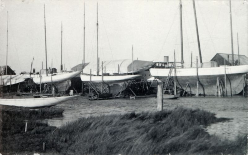  Yachts at Drake Bros., Tollesbury.

SMUGGLER and COCAINE to the left.

Yawl PALMOSA, 11ft 6in. on the right.

The names were given to Peter about 1980 - the 11ft 6in is probably the draft, but Peter believes it is nearer 10ft. 
Cat1 Tollesbury-->Woodrolfe Cat2 Yachts and yachting-->Sail-->Larger