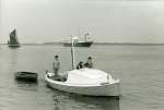 Dabchicks first rescue boat during the 1962 Blackwater Barge Match. 
L-R Franki Drinkall, Dad & Mum Drinkall, Bev Drinkall.
Laid up Shell tanker in the background.