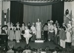  Birch School. Wedding of the Painted Doll produced in the Village Hall, c1955.
 Anne Baines on pedestal in the centre. Michael Lynch golliwog to the right of her.
 Essex County Standard photo 4571/B.  ELB_SCH_183