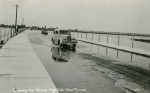 93. ID MM2013_MEA_033 Crossing the Strood, High Tide, West Mersea. 
Car DLB608.
Postcard mailed 31 December 1938 to Mrs Mears, Ivy House, East Mersea, from Hilda K. Page, ...
Cat1 Mersea-->Strood