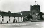  St. Mary's Church and The Square, Tollesbury. The village lock-up is nestling by the church wall. Postcard 1109 mailed 30 October 1961..  CG10_027