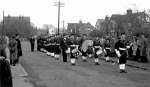 Sea Cadet Band at first Armistice Day Parade, outside Legion Hall in Barfield Road. 
Names from Owen Fletcher: L-R 1. Brian Jay, 2. John Telford, 3. Keith Mynard, 4. Bob Bisco (Petty Officer), 5. Ray Buck (drum - from Abberton), 6. Dennis Dustin, 7. Ray Coppin (bass drum), 8. Brian Marshall (drum), 9. Roger Sheldrake, 10. Dick Gladwell (Drum Major).
Also present is Burton Hewes. On the extreme right are Steve and David Conway with their parents. 1951. Photo: Bob Bisco Collection