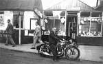 17. ID MIL_OPA_073 Bert Hempstead on motorcycle EV6989. Johnny Hart's Hairdressing in High Street, behind Arthur Cock's butchers.
EV registrations were issued in Essex March ...
Cat1 People-->Other Cat2 Mersea-->Shops & Businesses