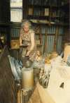 98. ID DB16_021 Dorothy Brown at Digby's shop, pouring paraffin.
Cat1 Families-->Stoker / Brown Cat2 Mersea-->Shops & Businesses