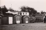 Beach Huts at West Mersea after the 1953 Flood. The Spinney Cafe is in the background.  IA02_013